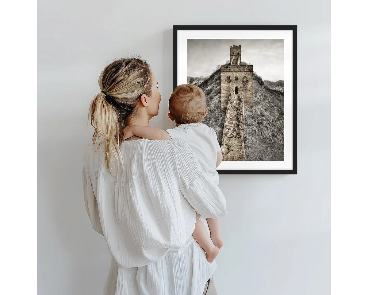 Watchtowers. Photography artwork of the Great Wall of China with a black frame, being admired by a mother and baby. 
