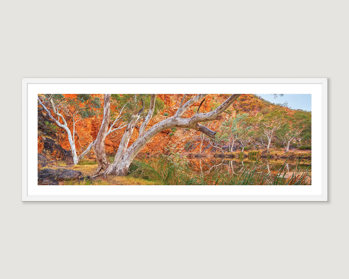 Framed artwork of a scenic Ellery Creek Big Hole, Tjoritja West MacDonnell with trees and red rock formations.