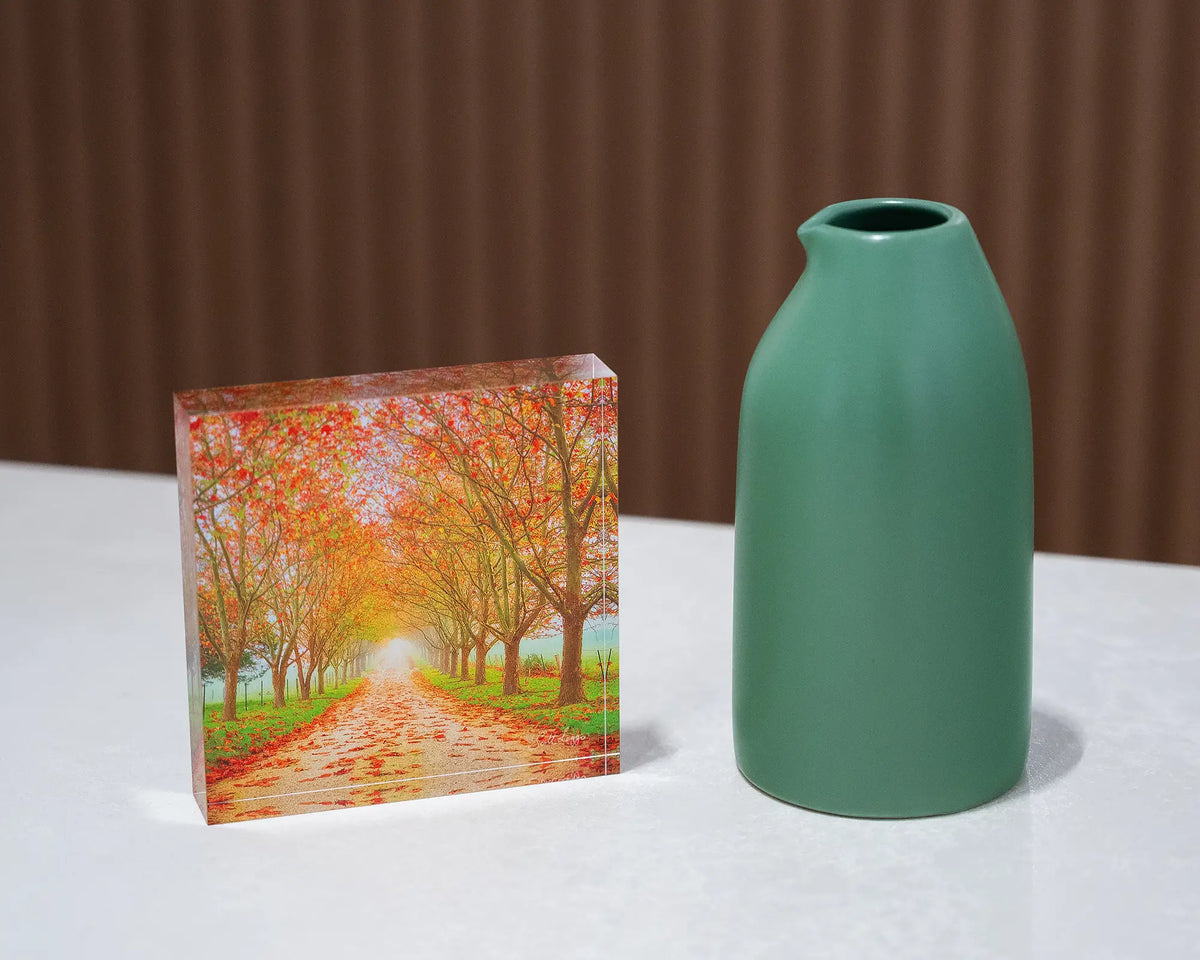 Welcome To Autumn. Acrylic block autumn tree lined road, on desk styled with small vase.