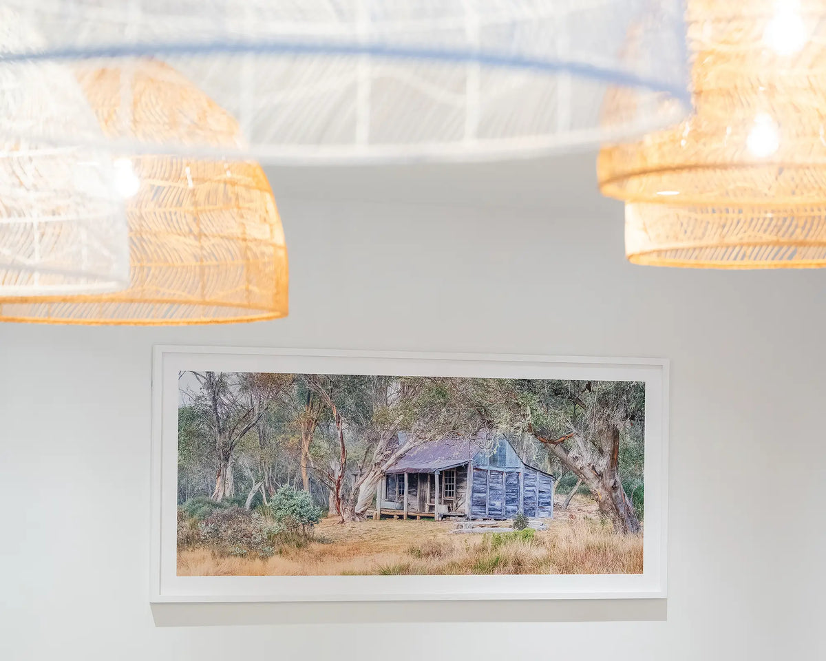 Wheelers Legacy. Wheelers Hut, Kosciuszko National Park, with white frame hung under restaurant lights.