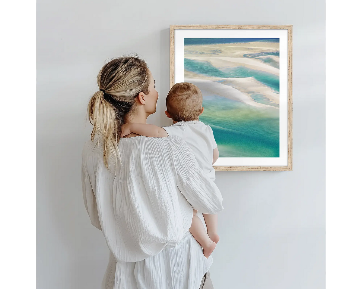 Whitsunday Colours. Aerial photography artwork of Hill Inlet with a timber frame, being admired by a mother and baby. 