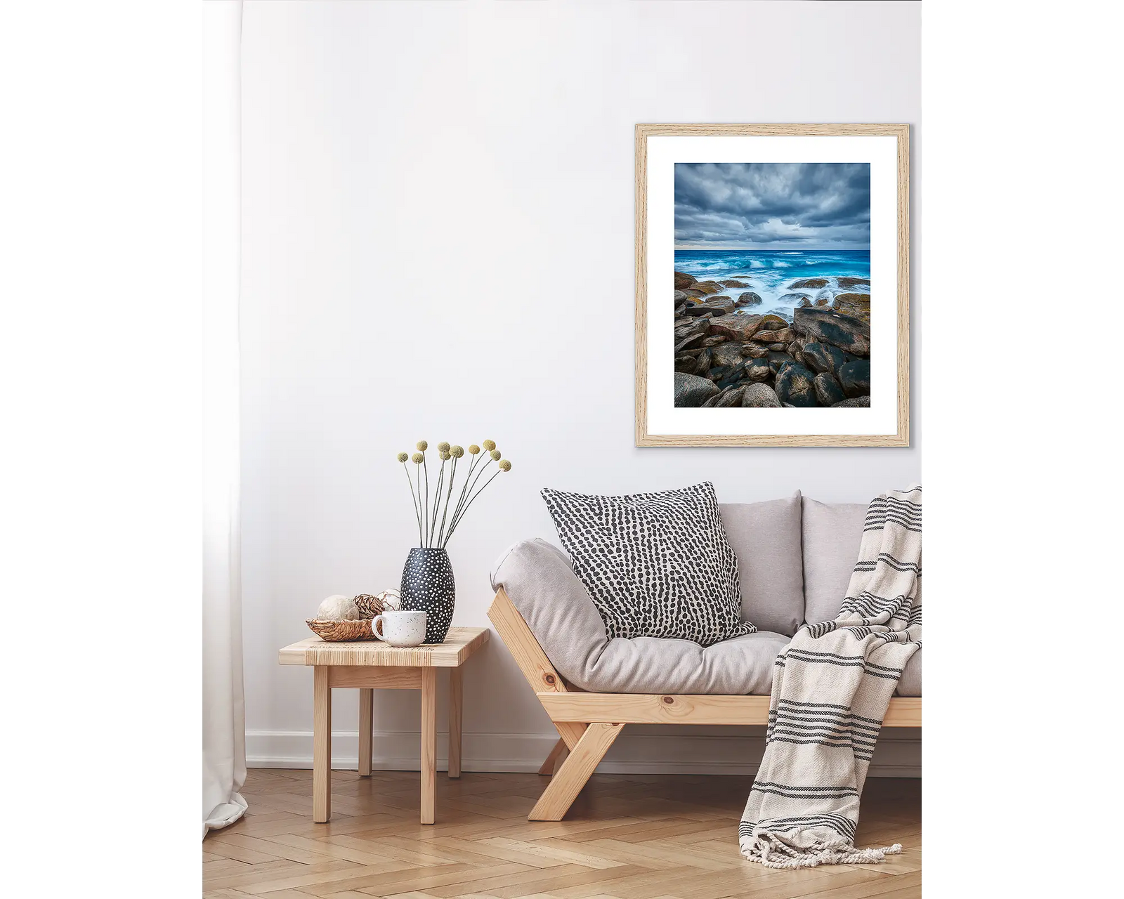 Framed artwork of a rocky coastline in Western Australia with ocean waves and cloudy sky.