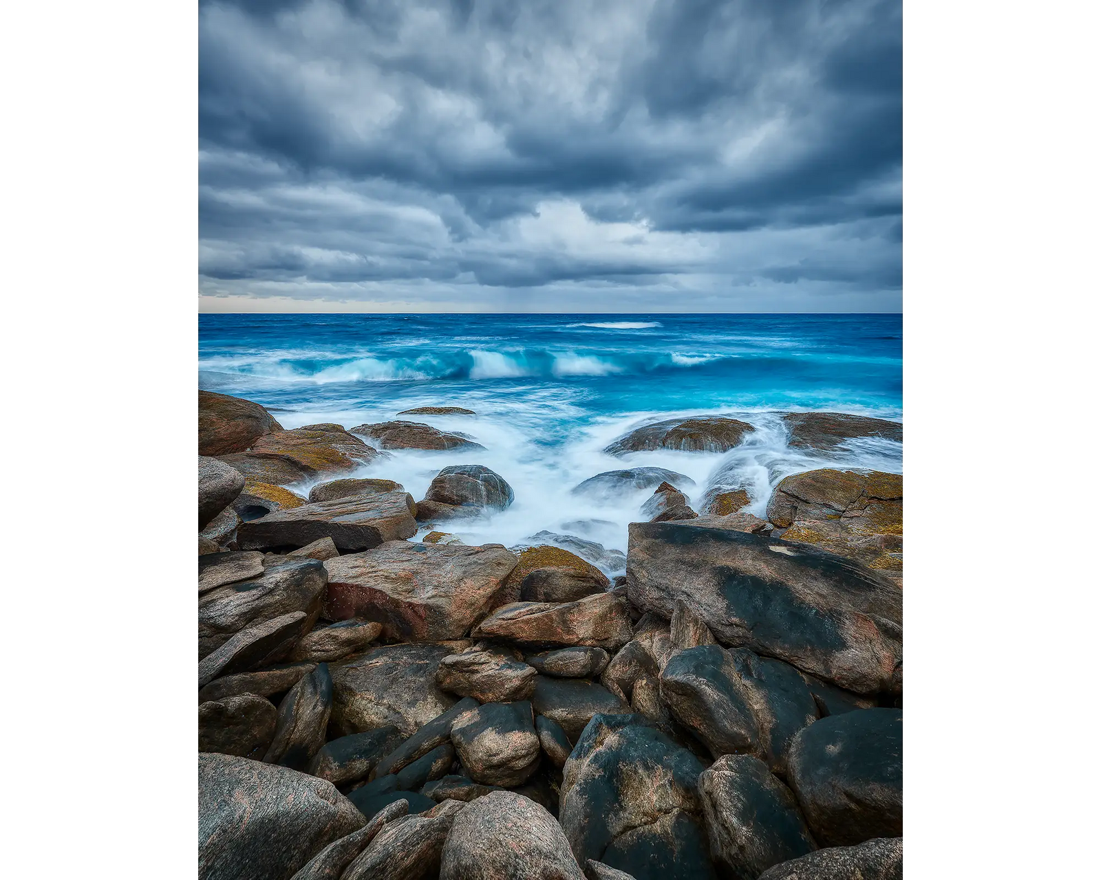 Waves crashing on granite boulders at Redgate Headland, Leeuwin-Naturaliste National Park, WA.