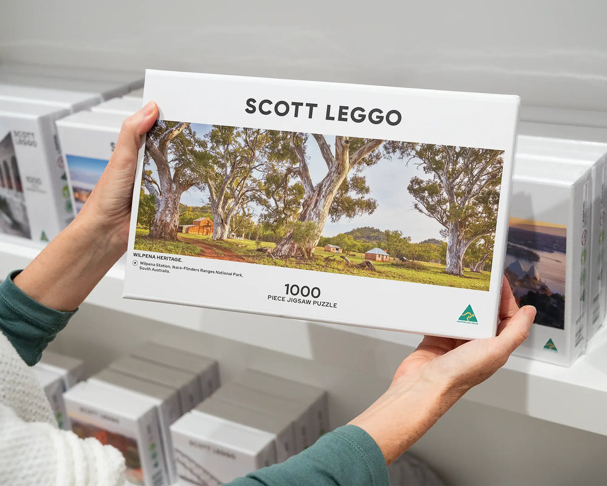 Wilpena Heritage. 1000 piece jigsaw puzzle of Wilpena Station, Ikara-Flinders Ranges National Park, being hand held.