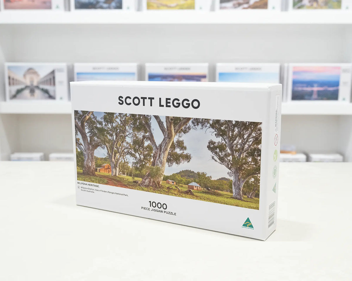 Wilpena Heritage. 1000 piece jigsaw puzzle of Wilpena Station, Ikara-Flinders Ranges National Park, sitting on a desk in the gallery.