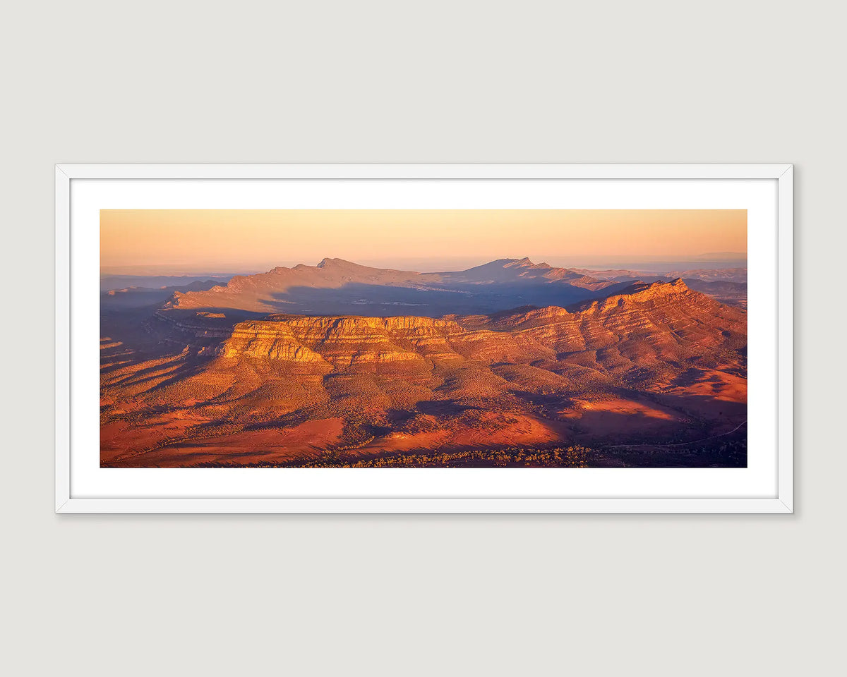 Framed landscape print of a Wilpena Pound desert scene with warm colours.