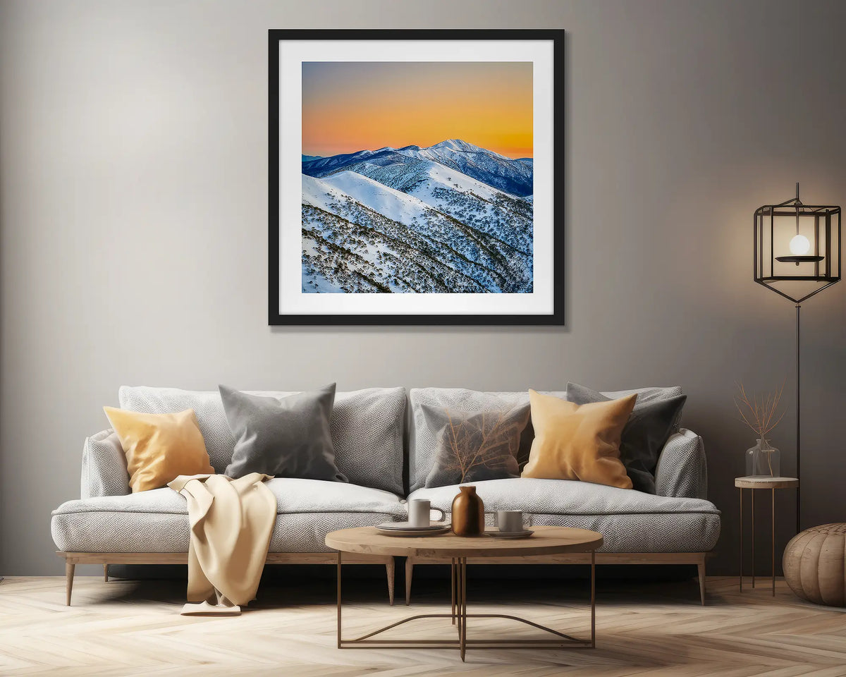 Winter Glow. Alpine artwork with a black frame, on a lounge room wall. 