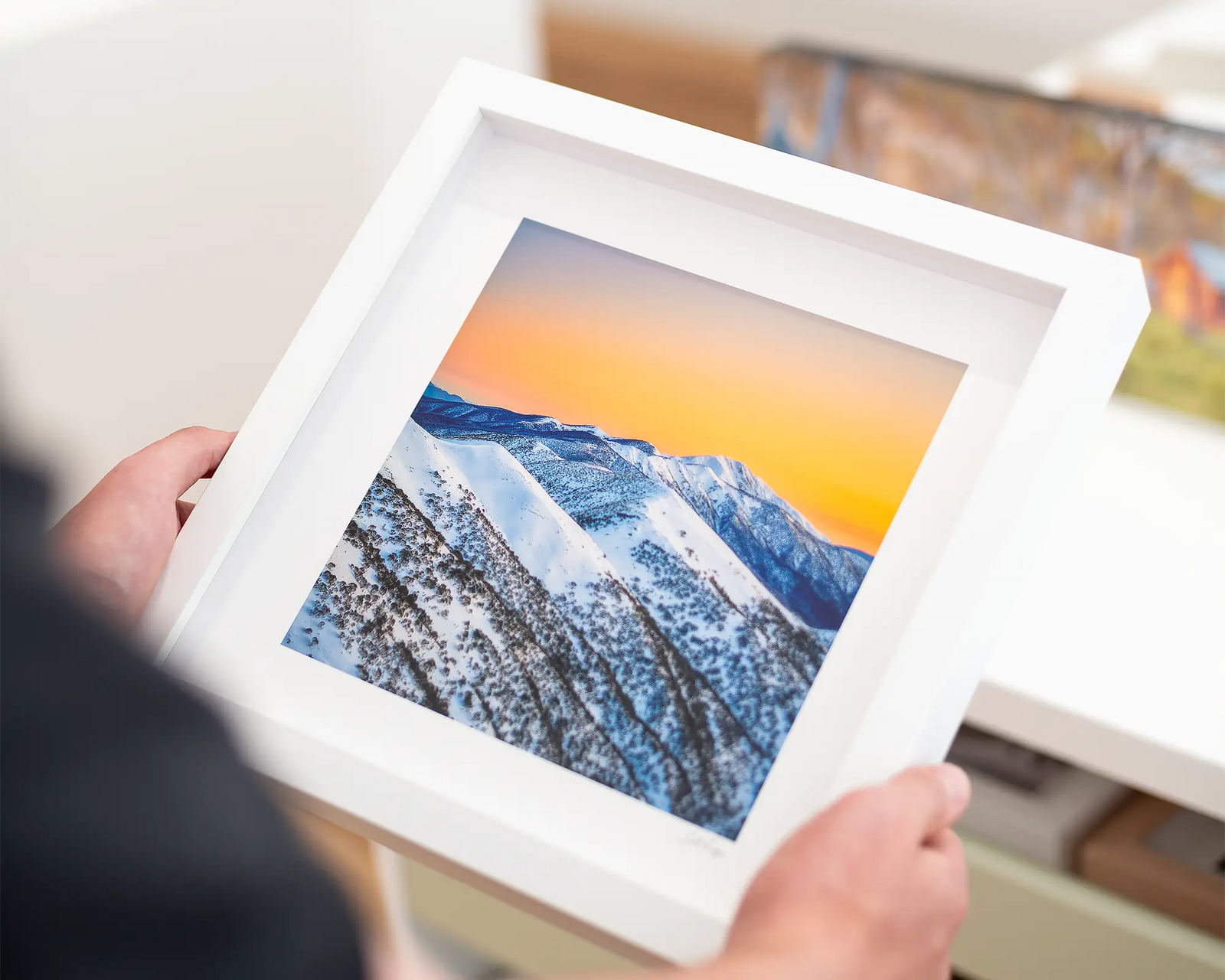 Framed photograph of a snow covered Mt Feathertop with a sunset sky.