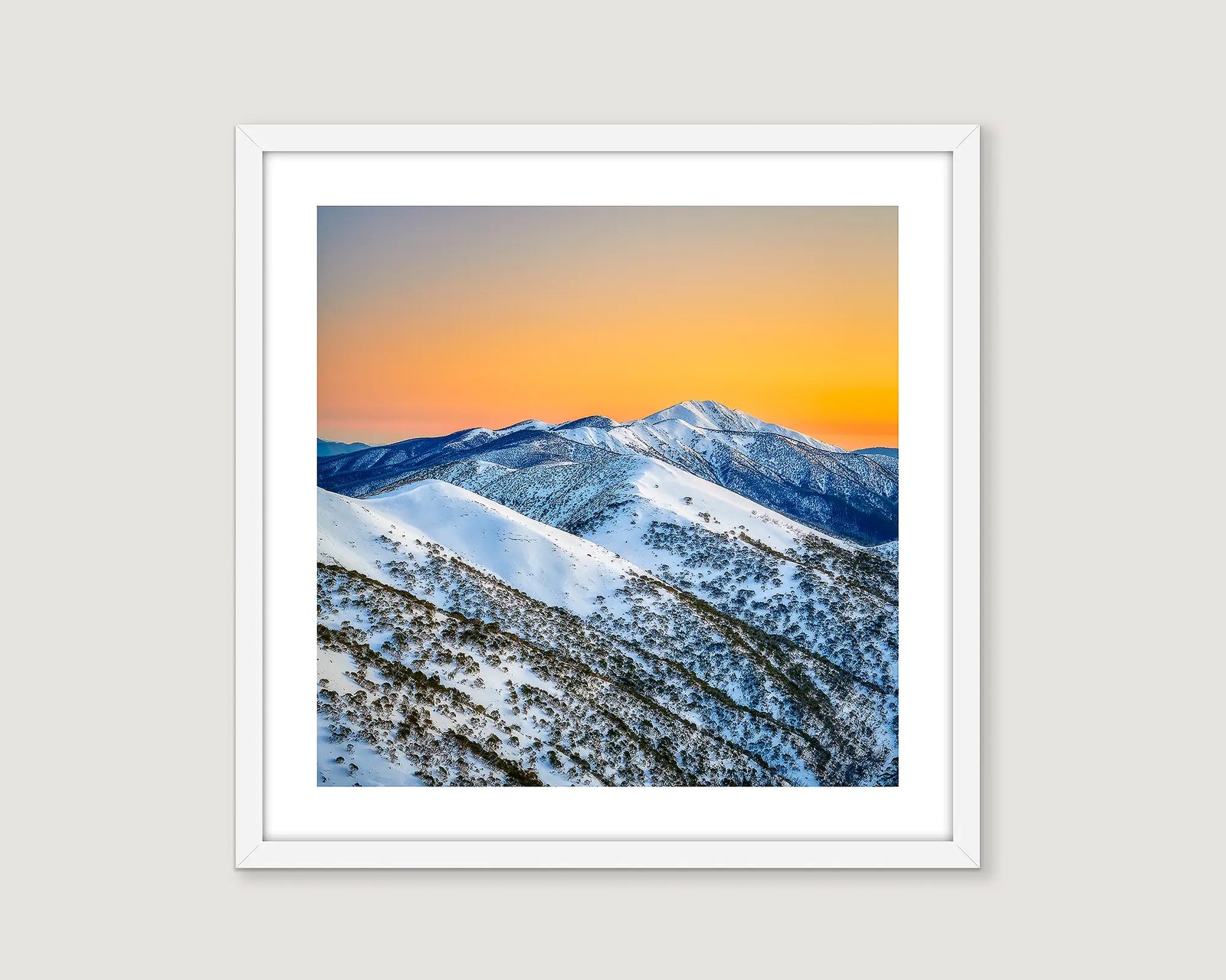 Framed photograph of a snow covered Mt Feathertop with a sunset sky.