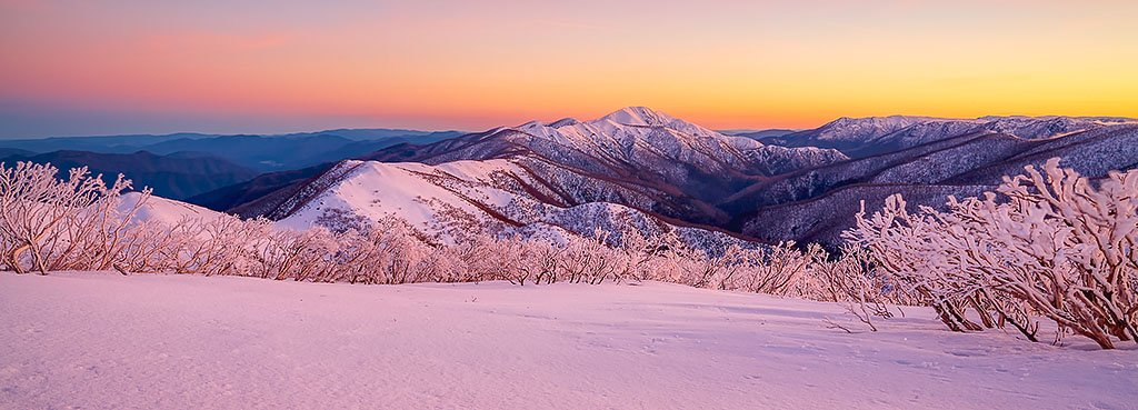 Sunrise from Mount Hotham looking to Mount Feathertop at sunrise with snow